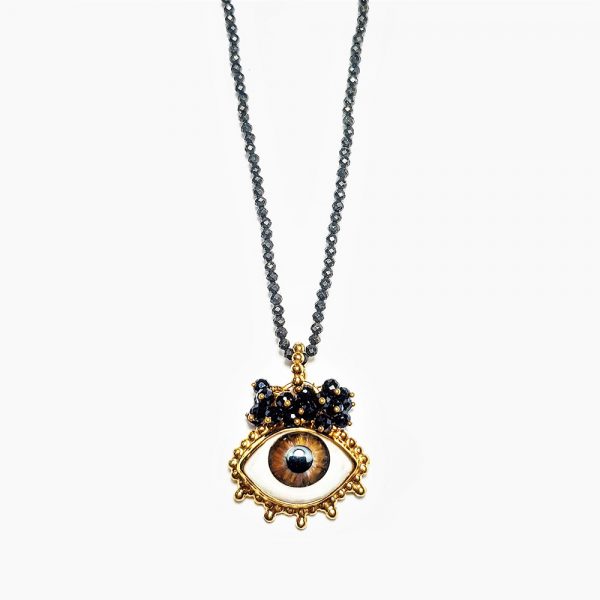Necklace with painted brown eye and crystals