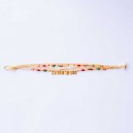 Bracelet with beige cord and gold-plated elements