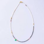 Necklace with white and black pearl and gold plated